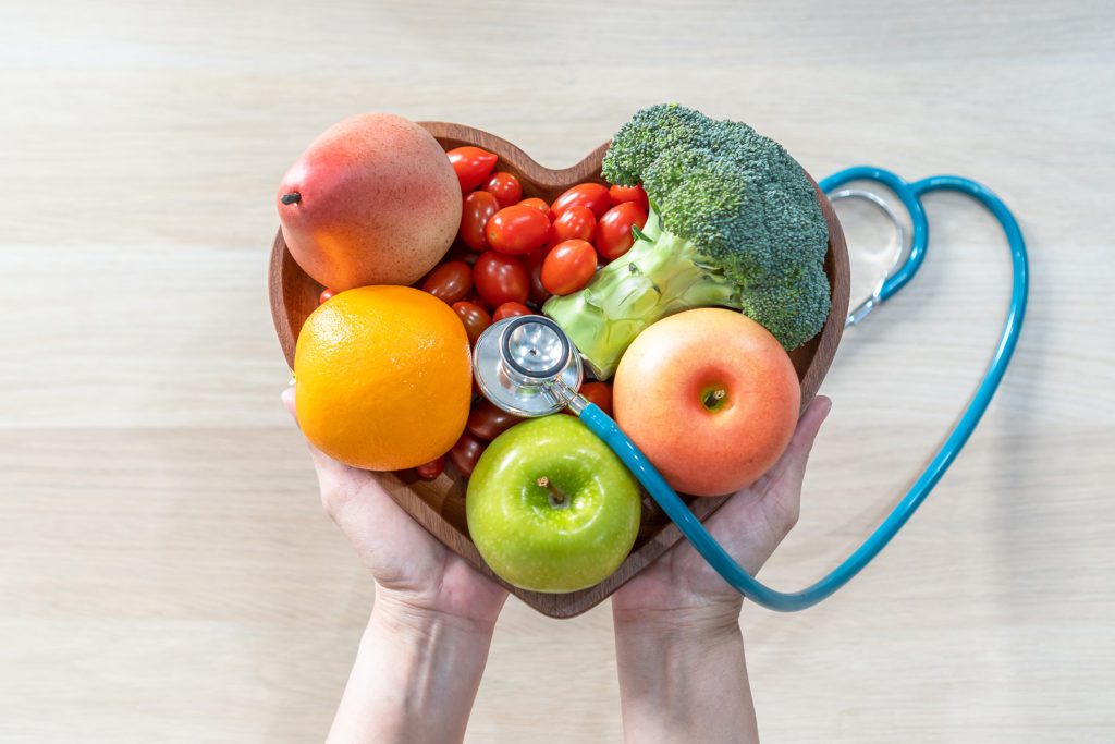 Vegetables in the heart shaped bowl with a stethoscope